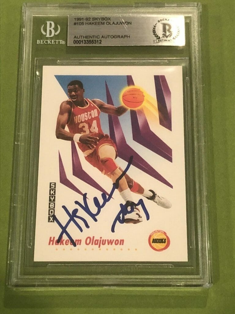 HAKEEM OLAJUWON SIGNED 1991-92 SKYBOX CARD #105 BECKETT AUTHENTICATED BAS COLLECTIBLE MEMORABILIA