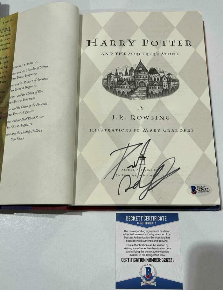 DANIEL RADCLIFFE SIGNED HARRY POTTER AND THE SORCERER’S STONE BOOK BECKETT 180 COLLECTIBLE MEMORABILIA