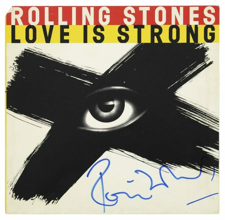 RONNIE WOOD ROLLING STONES SIGNED LOVE IS STRONG 45 RPM ALBUM COVER BAS #BG82269 COLLECTIBLE MEMORABILIA