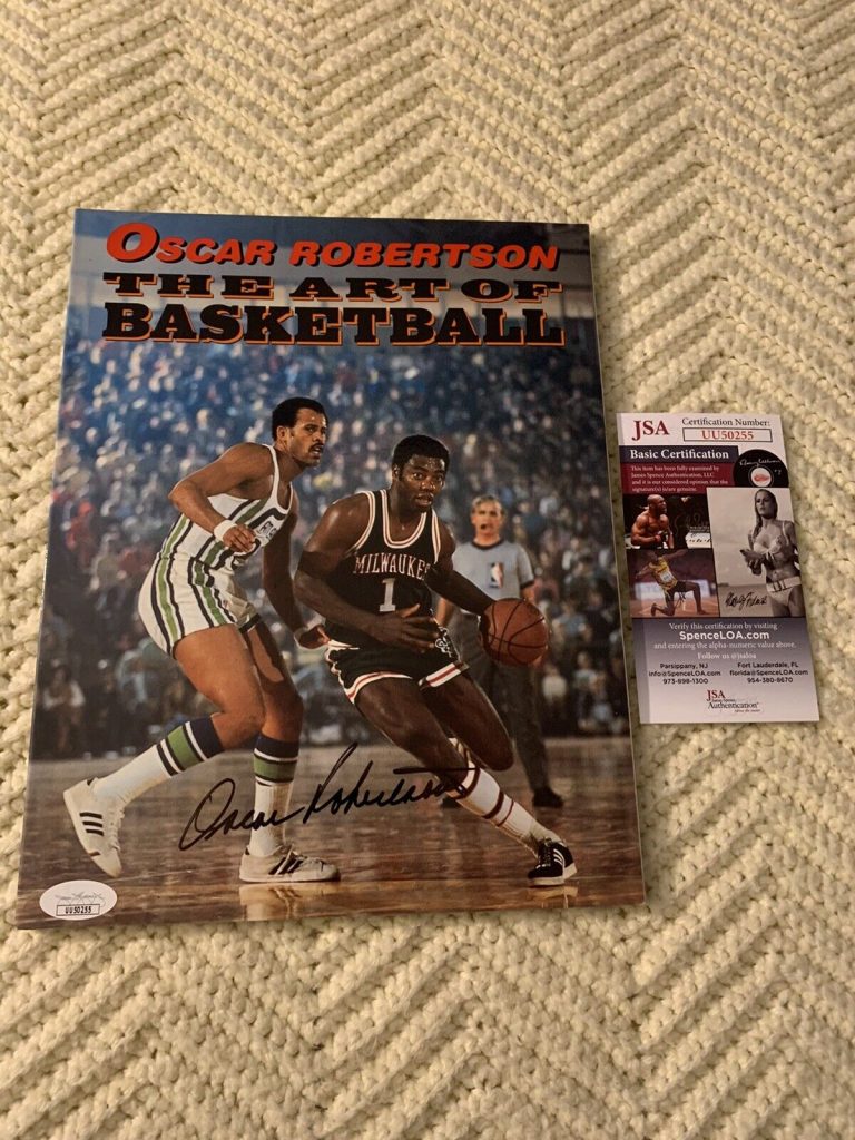 OSCAR ROBERTSON SIGNED PAPERBACK BOOK JSA AUTHENTICATED COA ART OF BASKETBALL
 COLLECTIBLE MEMORABILIA