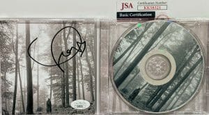 TAYLOR SWIFT SIGNED AUTOGRAPH CD COVER INSERT “FOLKLORE” JSA
 COLLECTIBLE MEMORABILIA