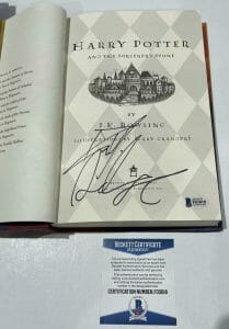 DANIEL RADCLIFFE SIGNED HARRY POTTER AND THE SORCERER’S STONE BOOK BECKETT 100 COLLECTIBLE MEMORABILIA