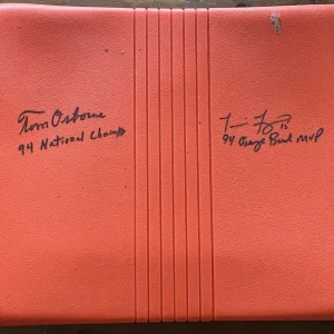TOM OSBORNE & TOMMIE FRAZIER SIGNED ORANGE BOWL SEAT BAS BH20216 W/1994 CHAMPS
