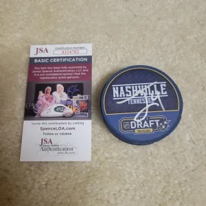 THEO LINDSTEIN AUTOGRAPHED NHL 2023 DRAFT HOCKEY PUCK JSA ST LOUIS BLUES SIGNED
