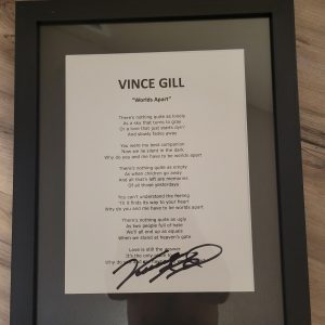 VINCE GILL SIGNED FRAMED WORLDS APART AUTOGRAPHED LYRIC SHEET
