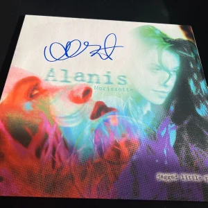 ALANIS MORISSETTE SIGNED AUTOGRAPH VINYL JAGGED LITTLE PILL IRONIC BECKETT BAS F