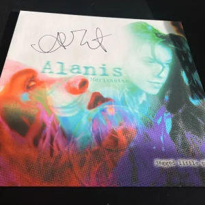 ALANIS MORISSETTE SIGNED AUTOGRAPH VINYL JAGGED LITTLE PILL IRONIC BECKETT BAS B
