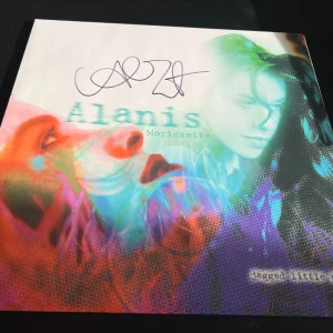 ALANIS MORISSETTE SIGNED AUTOGRAPH VINYL JAGGED LITTLE PILL IRONIC BECKETT BAS G