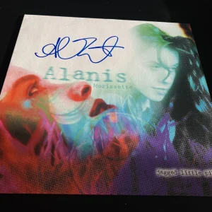 ALANIS MORISSETTE SIGNED AUTOGRAPH VINYL JAGGED LITTLE PILL IRONIC BECKETT BAS K