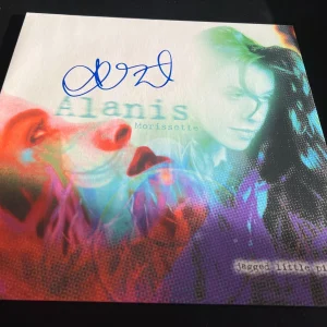 ALANIS MORISSETTE SIGNED AUTOGRAPH VINYL JAGGED LITTLE PILL IRONIC BECKETT BAS N