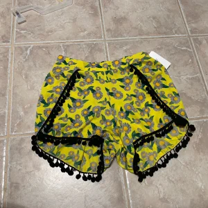 L Word TV Show Wardrobe Tea & Rose Yellow Womens Sexy Pom Pom Shorts
