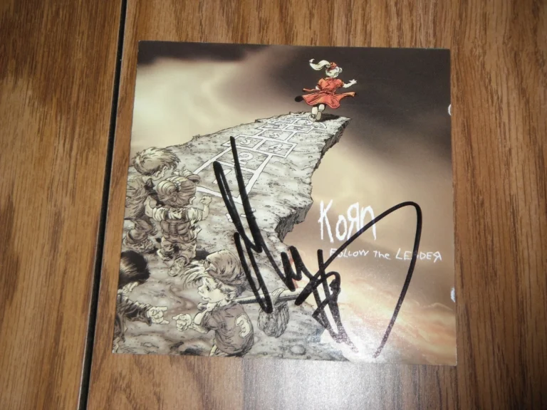KORN GROUP SIGNED FOLLOW THE LEADER CD COVER