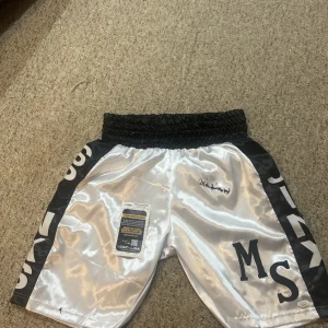 MIKE MICHAEL SPINKS JINX SIGNED AUTOGRAPH BOXING TRUNKS SHORTS JSA COA BOXER HOF