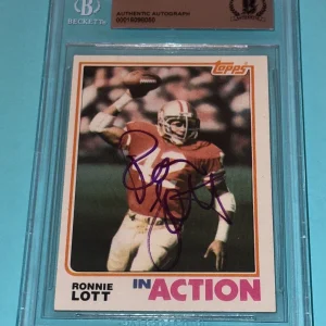 RONNIE LOTT Signed 1982 TOPPS ROOKIE in action Card #497 Beckett VINTAGE SIG