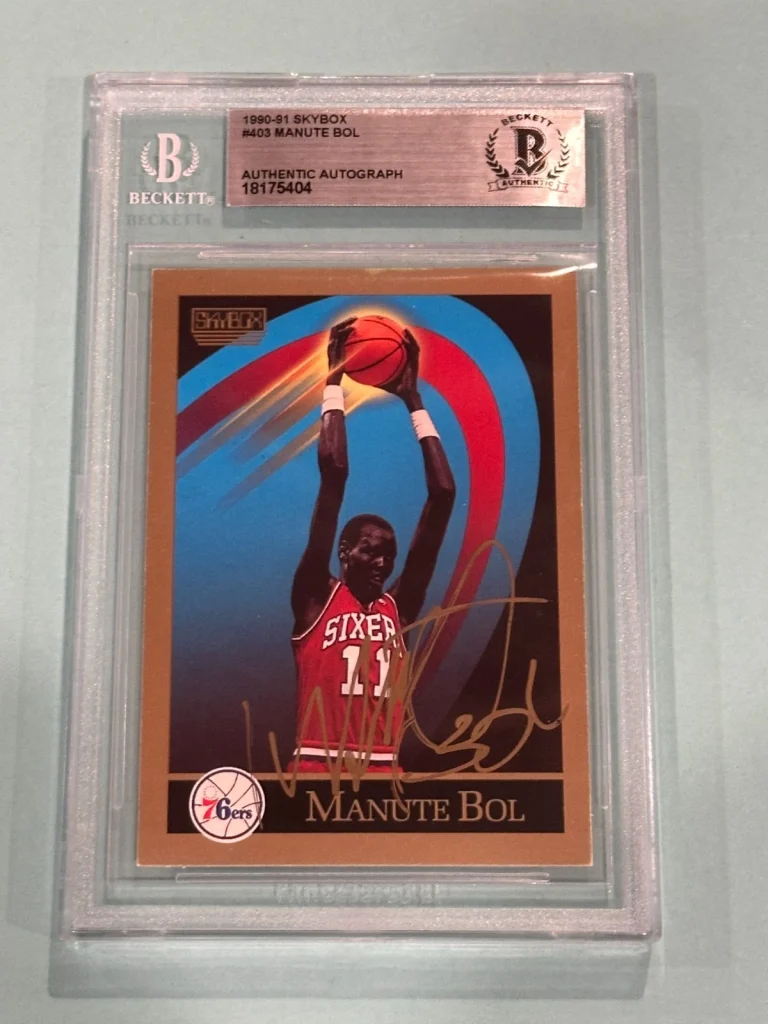 MANUTE BOL Signed 1990-91 SKYBOX Card #403 Beckett (BAS)