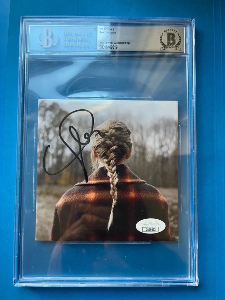 Taylor Swift Signed Auto Evermore CD Booklet Beckett BAS ENCAPSULATED CASE
