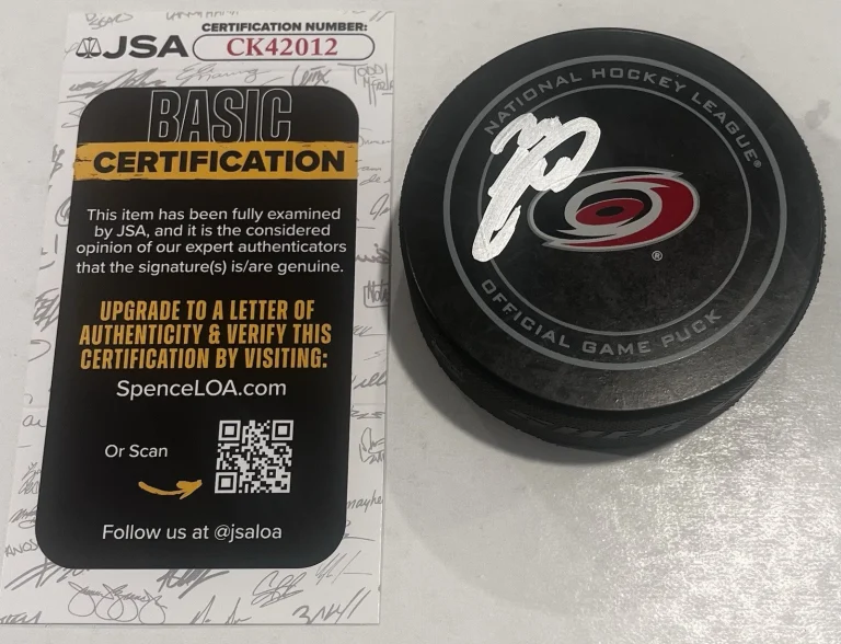 SEBASTIAN AHO SIGNED CAROLINA HURRICANES GAME HOCKEY PUCK W/ CASE JSA COA