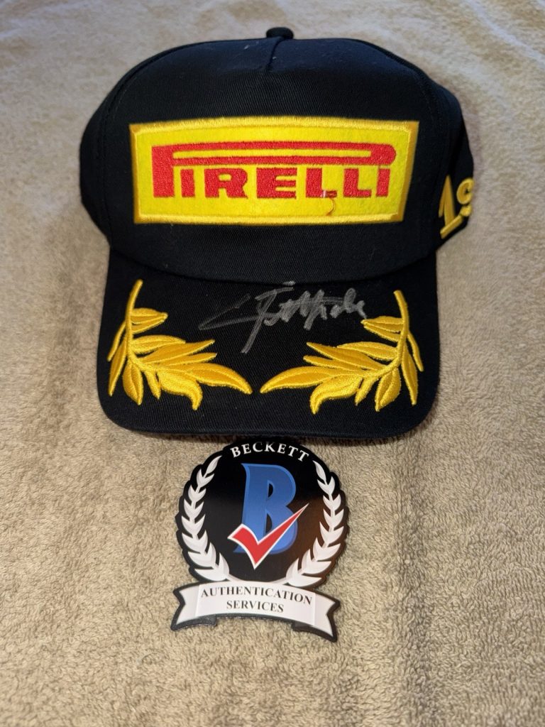 Emerson Fittipaldi Signed Pirelli Podium Hat F1 Star McLaren F1 Champion Beckett