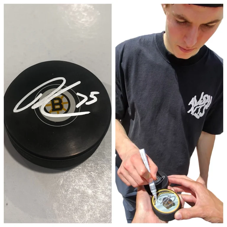 LUKAS REICHEL SIGNED BOSTON BRUINS HOCKEY PUCK W/ CASE COA
