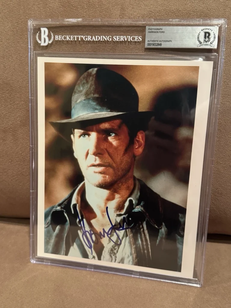 Harrison Ford Signed Raiders of the Lost Ark Photograph Beckett Slab