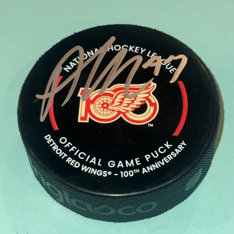 ALEX DEBRINCAT Signed Detroit RED WINGS 100th Official GAME Puck Beckett (BAS)