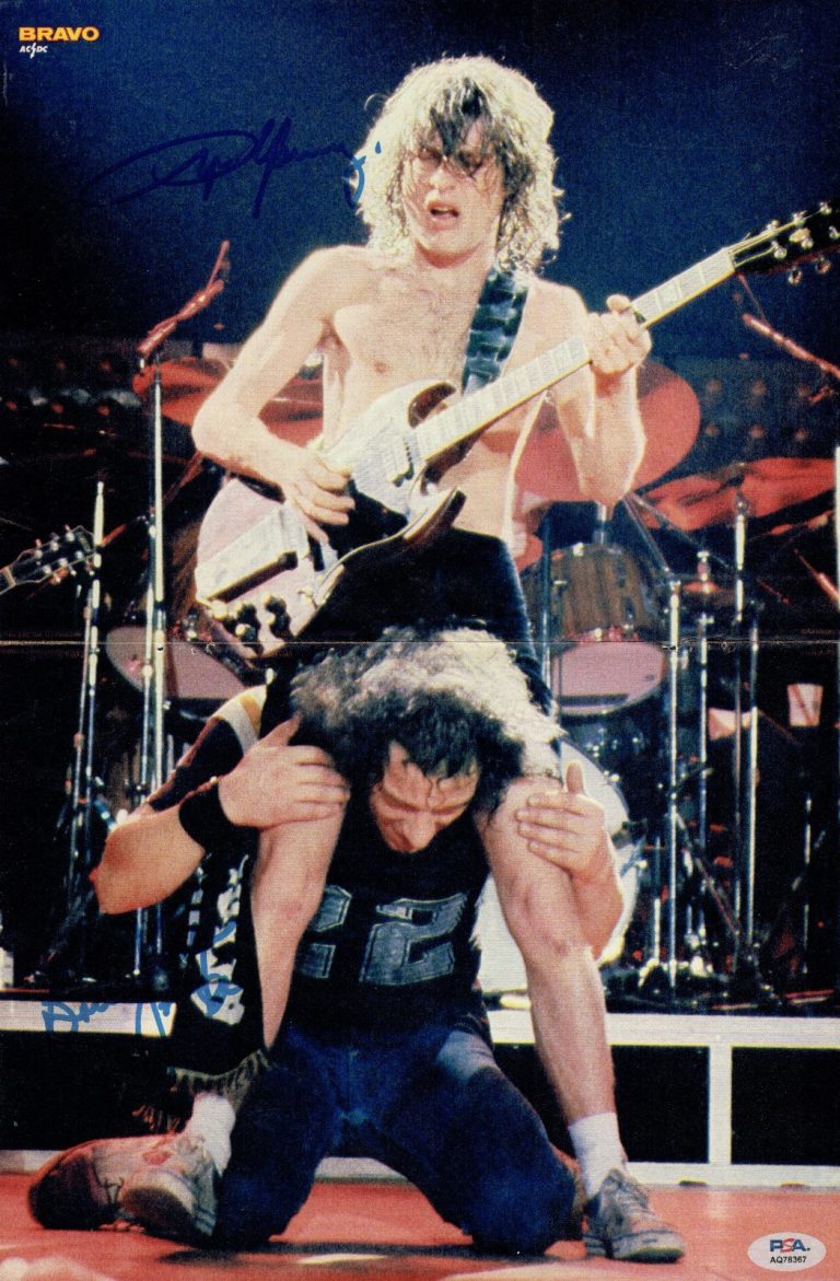 The AC/DC signed 11x17 Magazine Photo Angus Young & Brian Johnson PSA Stickered