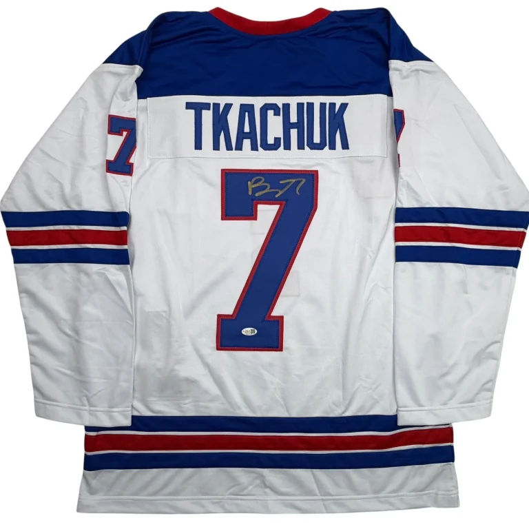 Autographed/Signed Brady Tkachuk USA 2026 Olympics Gold White Jersey JSA COA