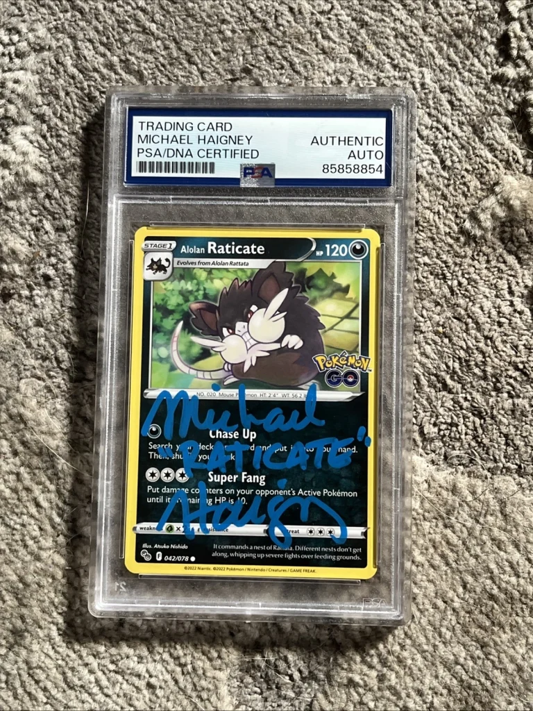 MICHAEL HAIGNEY SIGNED AUTOGRAPHED POKEMON CARD RATICATE  PSA ENCAPSULATED