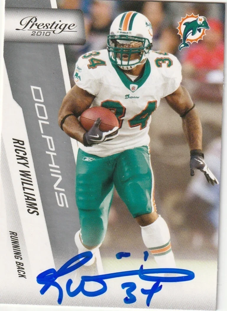 RICKY WILLIAMS MIAMI DOLPHINS SIGNED 2010 PLAY OFF PANINI CARD #104