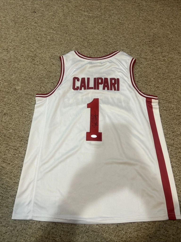 ARKANSAS RAZORBACKS- JOHN CALIPARI SIGNED AUTOGRAPH JERSEY PSA DNA COA HOF COACH