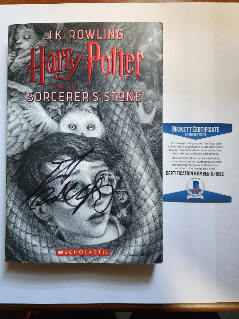 DANIEL RADCLIFFE SIGNED HARRY POTTER BOOK ILLUSTRATION COVER BECKETT BAS COA