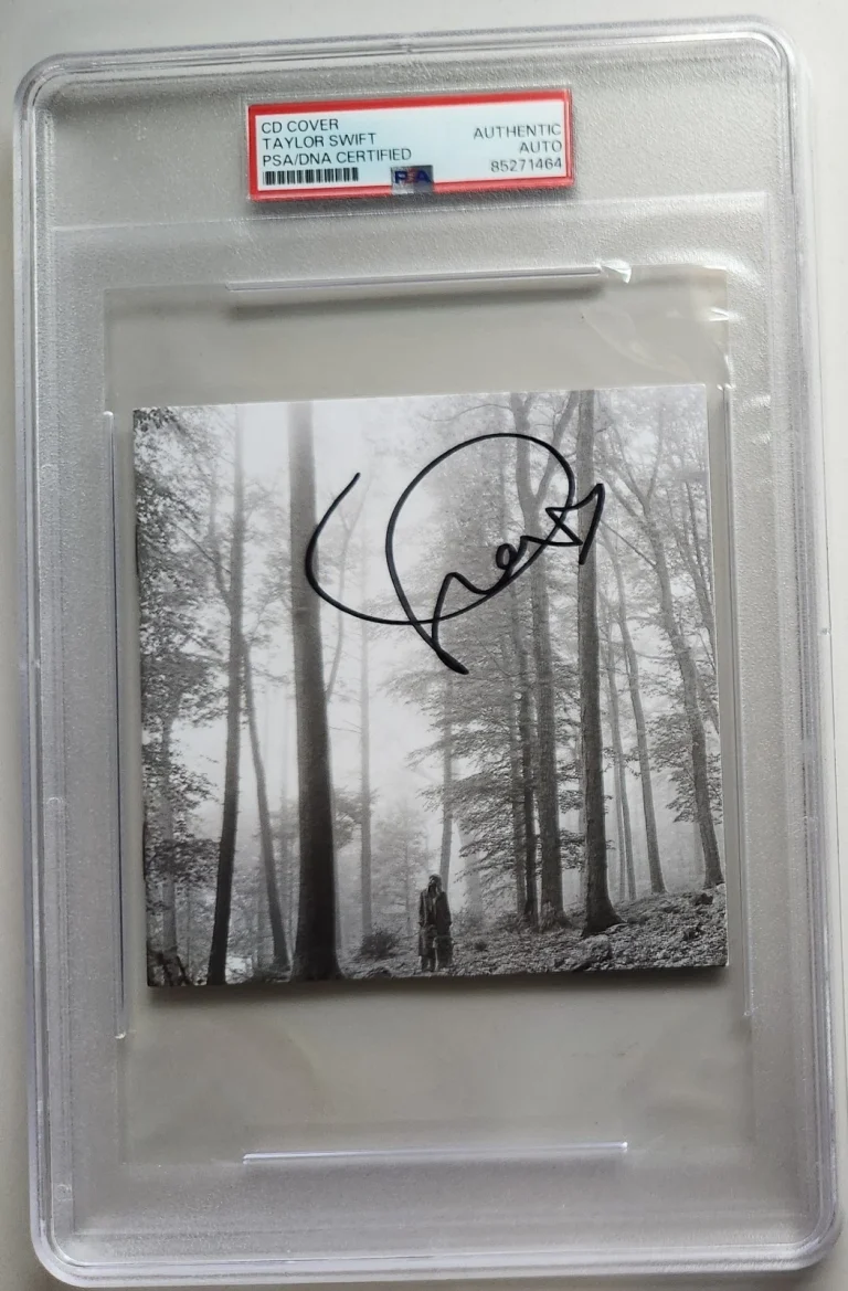 TAYLOR SWIFT SIGNED FOLKLORE CD MIDNIGHTS ERAS TOUR FORTNITE PSA SLAB COA RARE