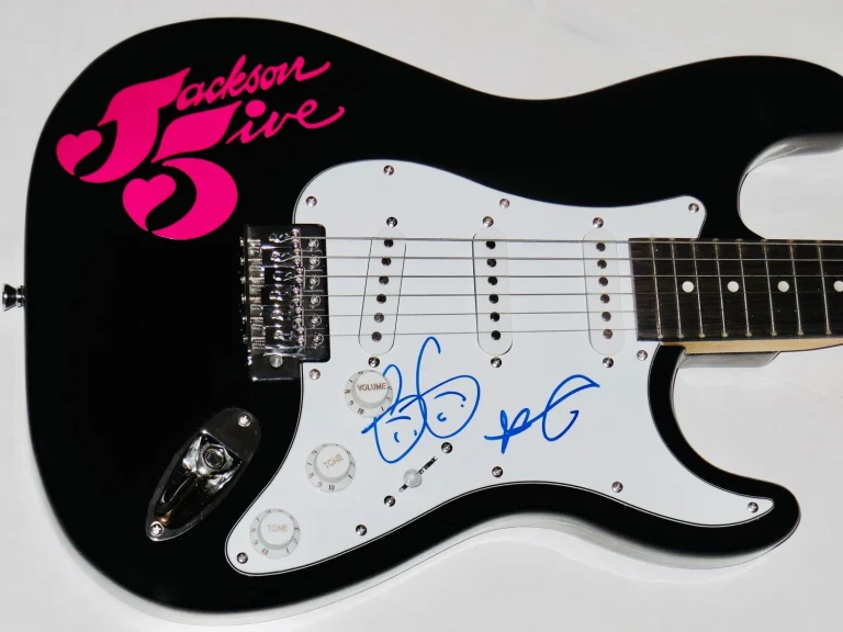 JERMAINE JACKSON & TITO JACKSON AUTOGRAPHED GUITAR (JACKSON FIVE) - W/ COA!