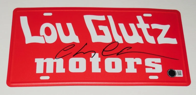 CHEVY CHASE AUTOGRAPHED LICENSE PLATE (VACATION LOU GLUTZ MOTORS) - BECKETT COA!