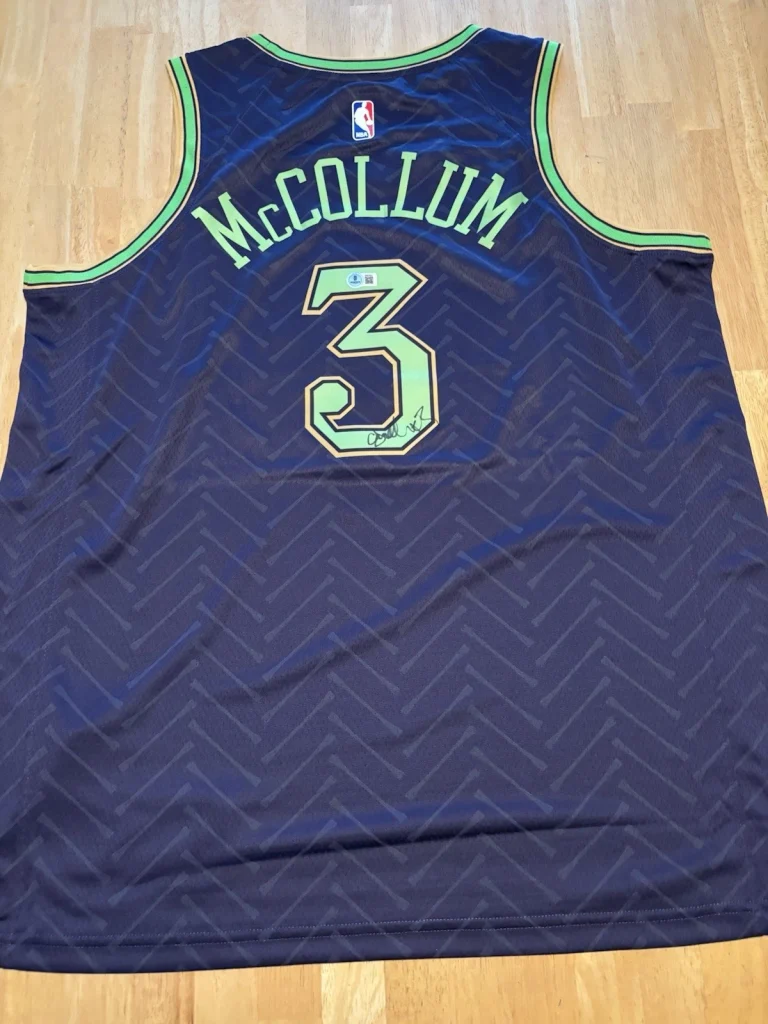 C.J. MCCOLLUM SIGNED AUTOGRAPHED NEW ORLEANS PELICANS JERSEY. Beckett Coa