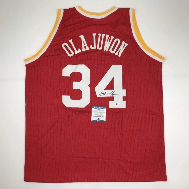 Autographed/Signed Hakeem Olajuwon Houston Red Jersey Beckett COA